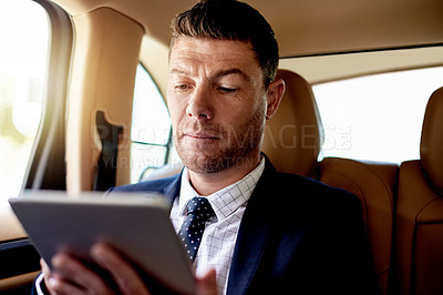 Buy stock photo Tablet, reading and businessman in car with communication, networking or email online for career. Research, digital technology and male corporate manager with contact on app in vehicle for transport.