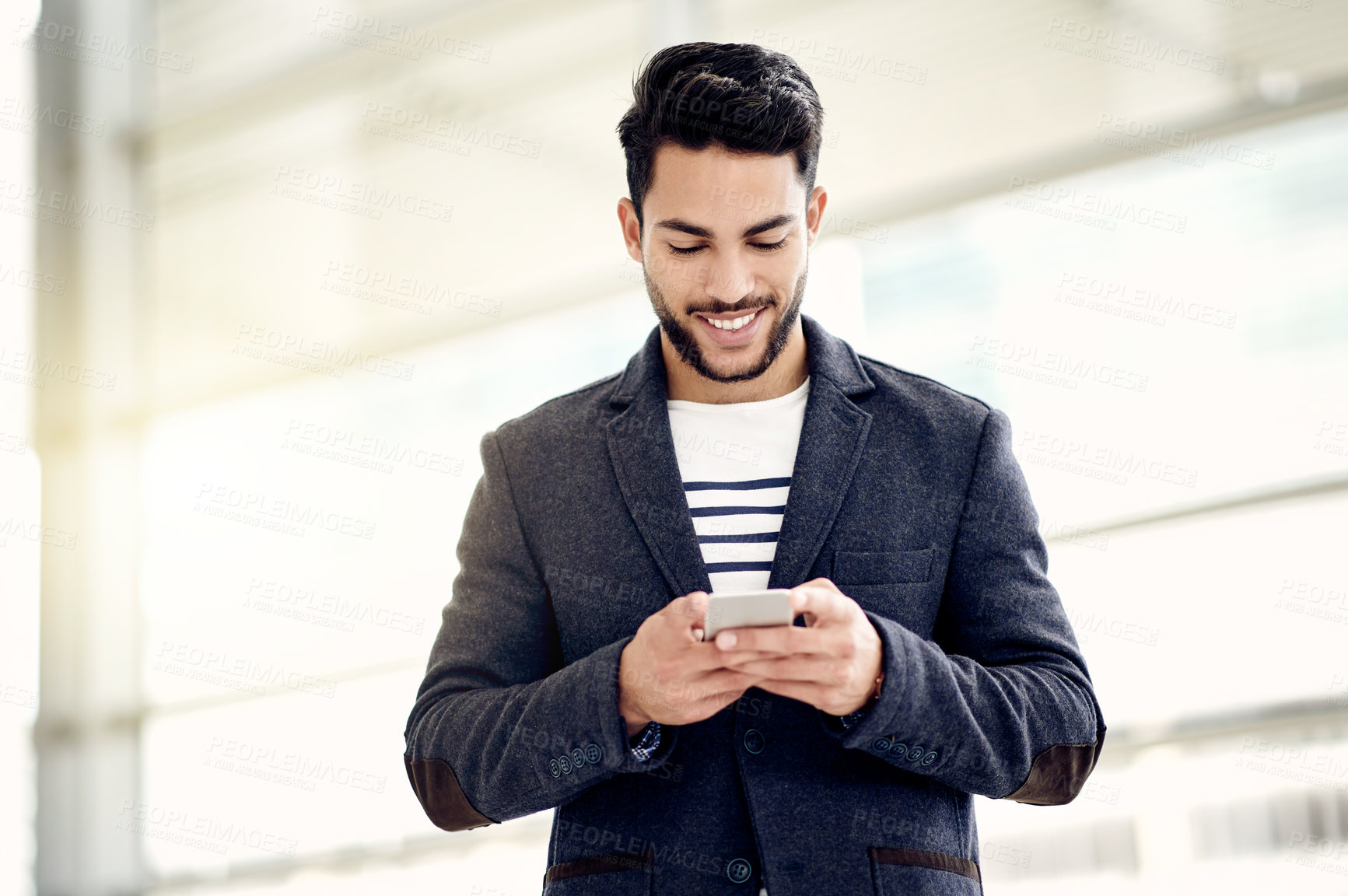Buy stock photo Business, man and typing with phone in office for text message, email response or check schedule. Professional, person and happy with smartphone at workplace for online research, networking and chat