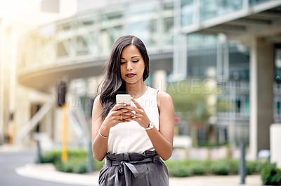 Buy stock photo Business woman, phone and texting in city with contact for taxi, travel and commute in street. Person, smartphone and scroll with mobile app at bus stop for transport, chat or social media in Mexico