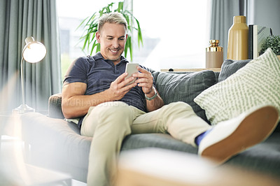 Buy stock photo Home, typing and man on sofa, cellphone and relax with social media, internet and connection. Apartment, smartphone and person on couch, online reading and communication with digital app and chatting
