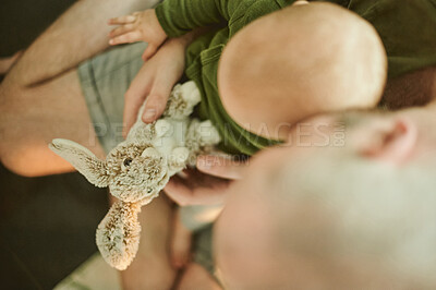 Buy stock photo Relax, toy and father with baby at home from top view for cute, cuddle and bonding. Child development, learning and youth with kid and man with stuffed rabbity for happiness, newborn and care