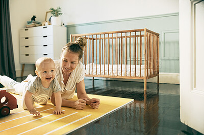 Buy stock photo Baby, child development and mother playing with infant on the floor of a house or home and bonding together. Care, motherhood and single parent or woman having fun with newborn kid with happiness