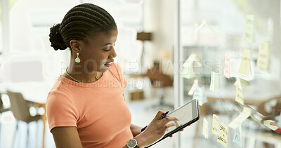 Buy stock photo Black woman, tablet and schedule planning for ideas or creative strategy on glass board at office. African female person with technology for brainstorming, tasks or agenda in startup at workplace