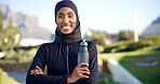 Muslim, portrait and black woman with water bottle for outdoor fitness, health or wellness in park. Islam, active or female person with smile, liquid or beverage for sustainability or hydration