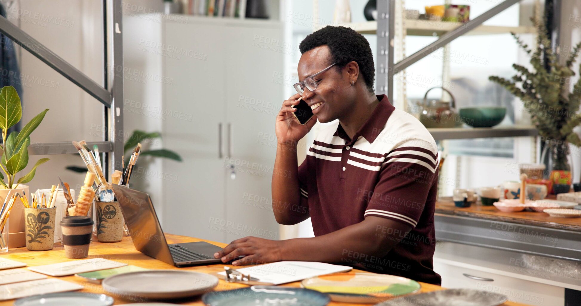 Buy stock photo Man, laptop and phone call in small business with pottery, customer service and online order for art. Happy, black person and talk in ceramics store with tech, entrepreneurship or contact clay buyer.