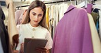 Woman, tablet or fashion designer with clothing in boutique for inventory or stock inspection. Female person, dressmaker or tailor checking list with technology for garment style or outfit production