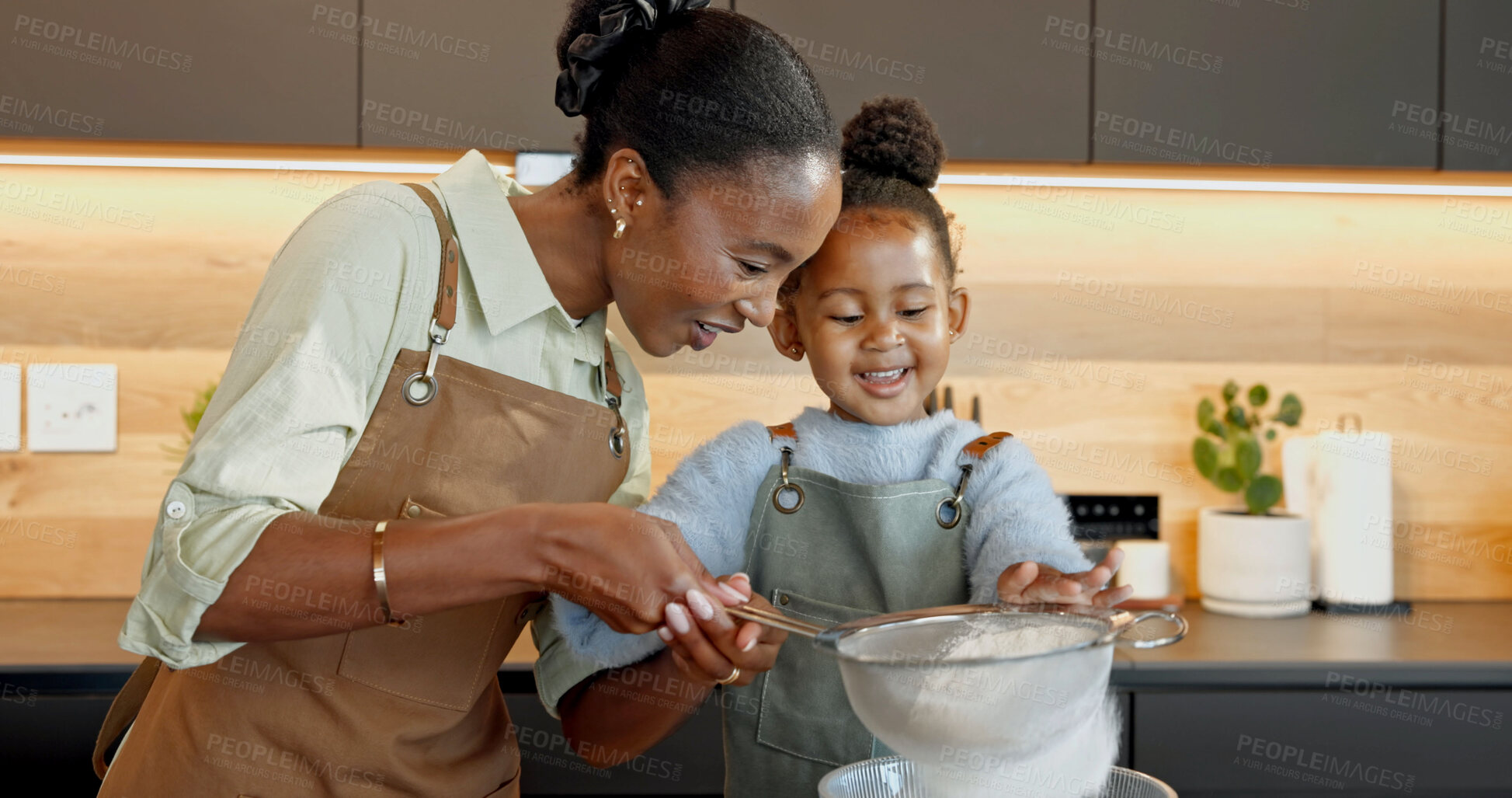 Buy stock photo Mother, child and baking in kitchen with sieve, teaching daughter and support with happiness. Black family, parent and girl flour sifting at home for learning, culinary skill development and help