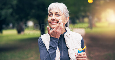 Buy stock photo Fitness, portrait or senior woman with sunscreen, sun safety or damage prevention in nature workout. Happy, wellness or old person with spf cream, UV protection or outdoor application in active aging