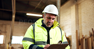Buy stock photo Writing, man or checklist in workshop for carpentry supervision, analog tracking or manual cut list. PPE, mature supervisor or clipboard for joinery inspection, job specs or record project progress