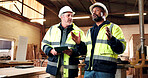 Carpenter, meeting and men with tablet in workshop, teamwork and planning for furniture production. Engineer, collaboration and mature people with tech, woodworking or project management in warehouse