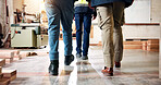 Carpentry, walking and legs of people in warehouse for planning, teamwork and timber business. Construction, contractor and workers in workshop for woodworking, lumber production and manufacturing