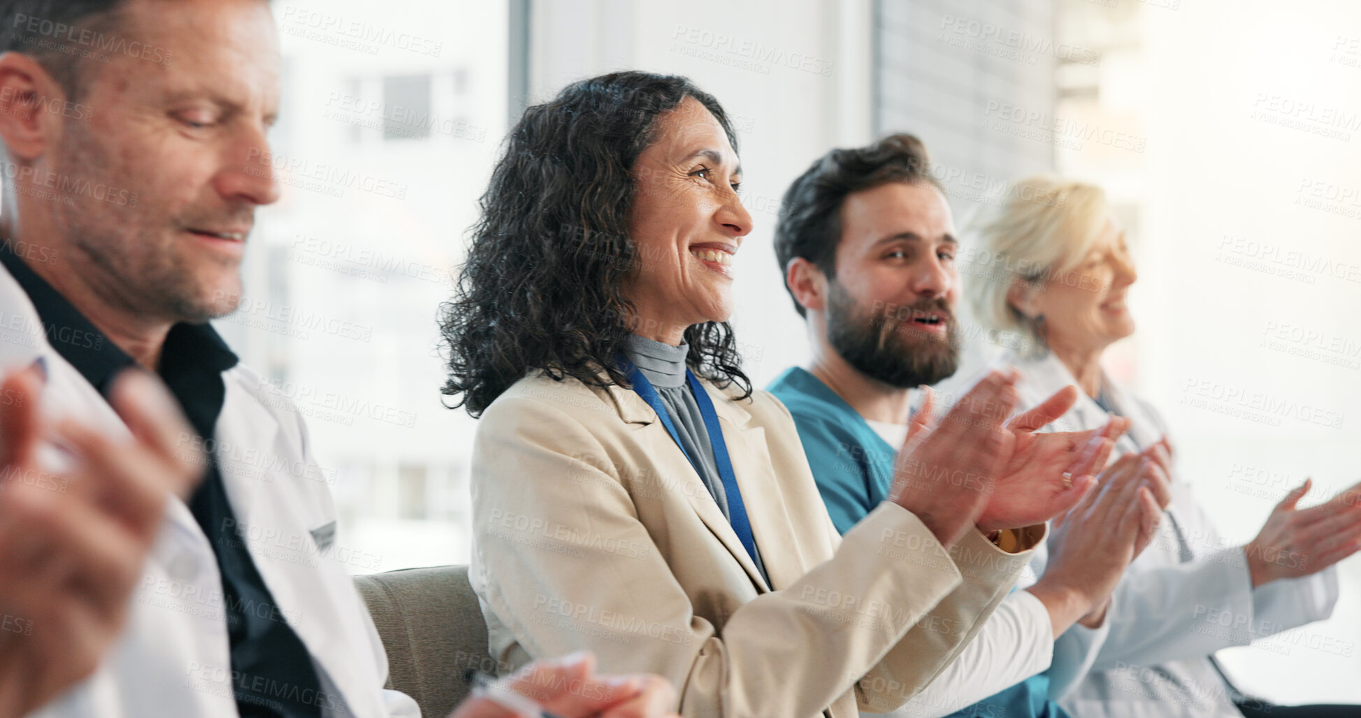 Buy stock photo Clapping, team and woman in healthcare seminar with smile for success, achievement or breakthrough. Mature person, doctors and applause at hospital conference with director for medical milestone
