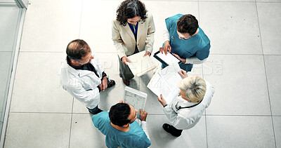 Buy stock photo Above, nurses and doctors with medical planning, documents or clinic budget update with tablet. People, meeting or hospital discussion with team, cost checklist or healthcare resource allocation