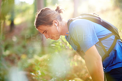 Buy stock photo Fitness, nature and man with earphones for running with race, marathon or training with challenge. Sports, break and male athlete outdoor in forest for cardio workout or exercise with lens flare.