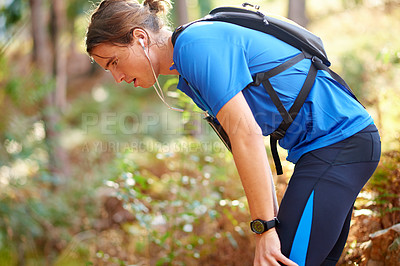 Buy stock photo Running, tired and breathing with man in nature for cardio workout, fatigue and training challenge. Exhausted, sweating and health with person in forest for exercise, resting and endurance runner