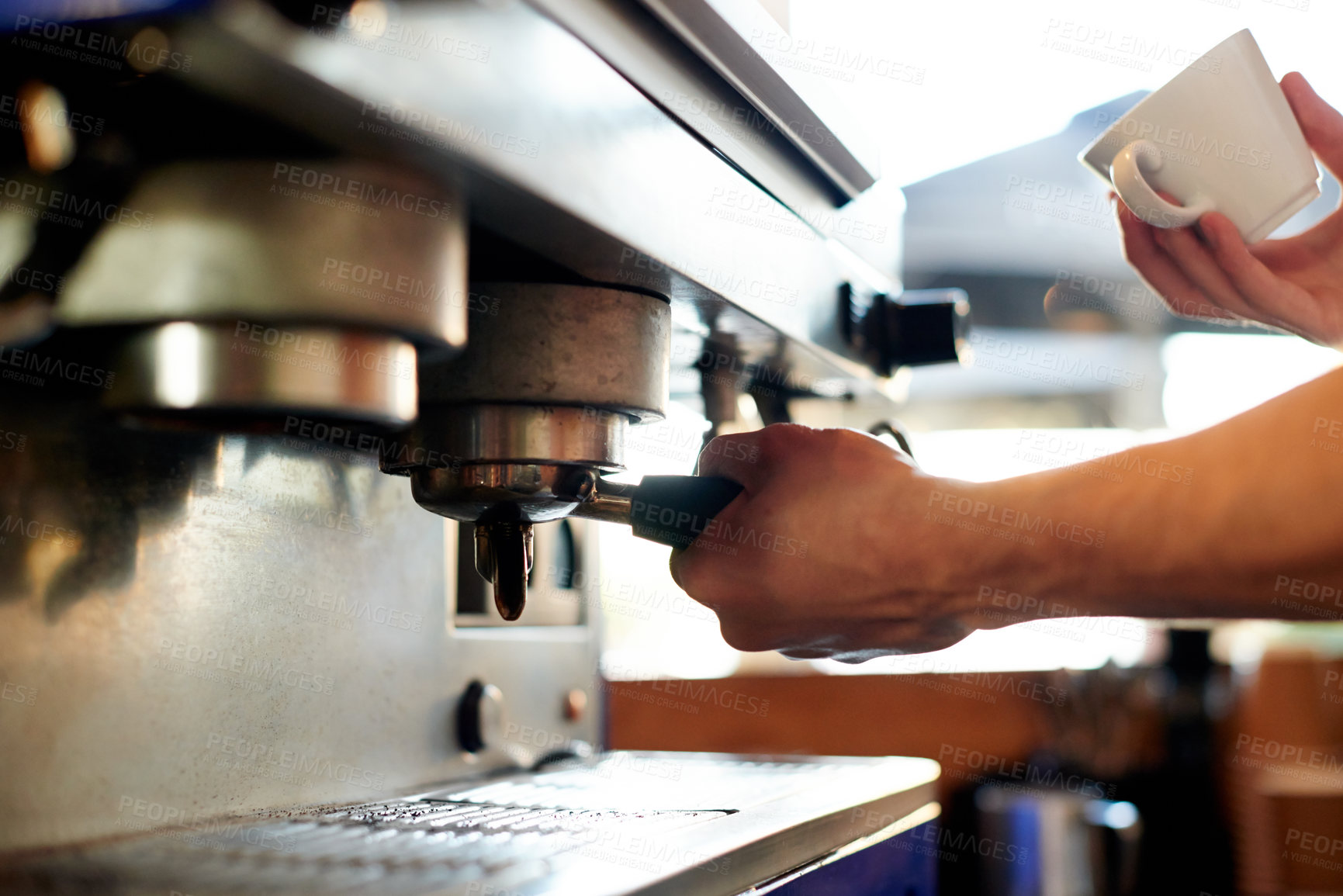 Buy stock photo Hands, barista and portafilter with cup at machine for coffee preparation, cafe order and espresso. Restaurant, service and man with process for premium blend caffeine, latte beverage and hospitality