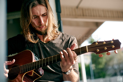 Buy stock photo Man, play guitar and busking in street, creativity and performance with talent, song and melody. Person, musician and artist in city with instrument, sound or inspiration for outdoor concert in Spain