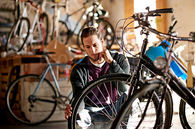 Buy stock photo Business, bicycle and man in store, thinking and fix with skills, decision and eco friendly travel. Shop owner, entrepreneur or employee in workshop, solution and cyclist with maintenance or choice
