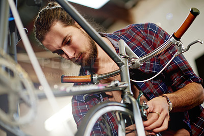 Buy stock photo Wheel, alignment or man with bicycle in workshop or store for repair, maintenance or upgrade. Small business, warehouse or mechanic in garage for bike parts, mechanical engineering or fixing tyre