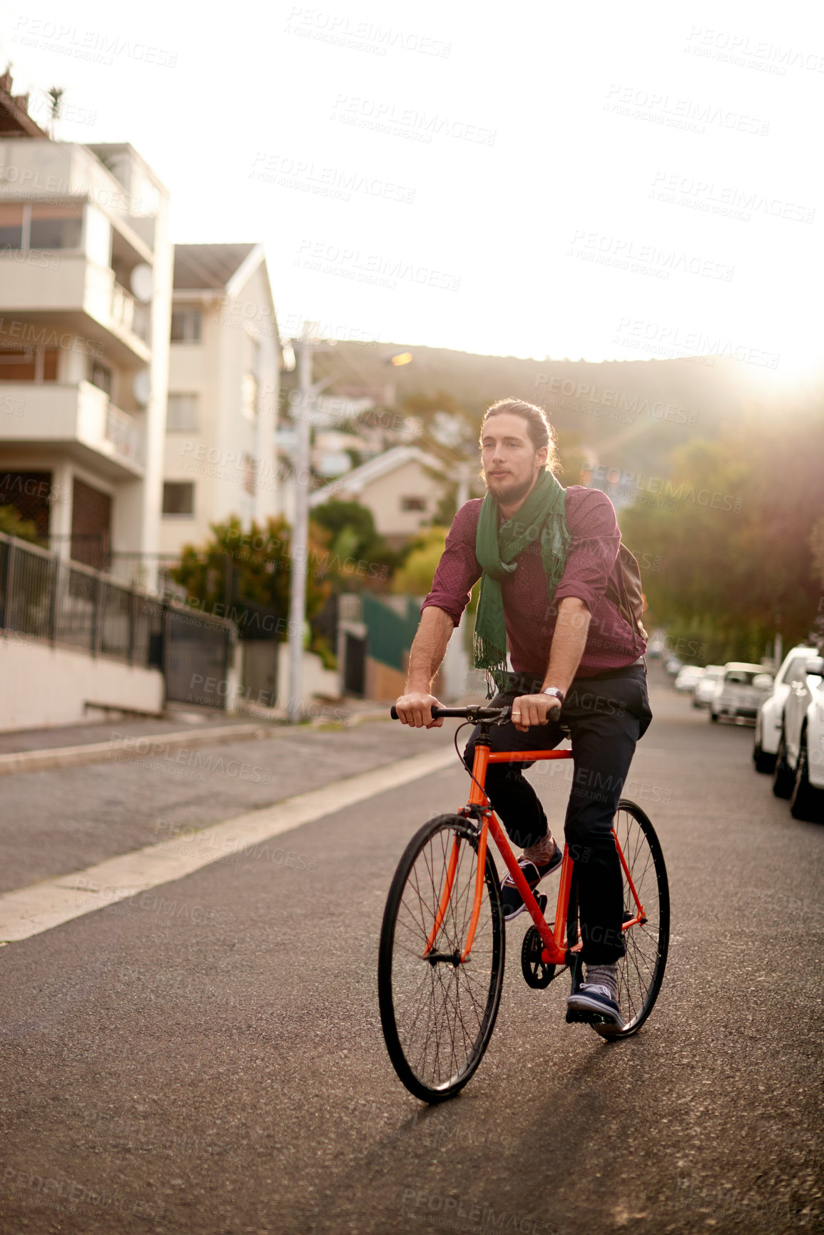 Buy stock photo Travel, adventure and man on bike in city for commuting, journey or carbon footprint on holiday. Street, cycling and person on bicycle for eco friendly transport on vacation in urban town by sunset.