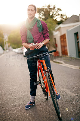 Buy stock photo Thinking, phone or man on bicycle in street for eco friendly transport, commute or city travel. Entrepreneur, texting or designer in urban town with location, mobile app or bike for online address