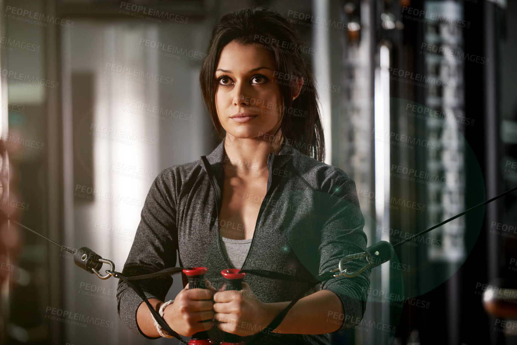 Buy stock photo Exercise, woman and cable machine at gym for biceps growth, strength training and endurance. Athlete, person and equipment at sports club for resistance challenge, arm workout and functional fitness