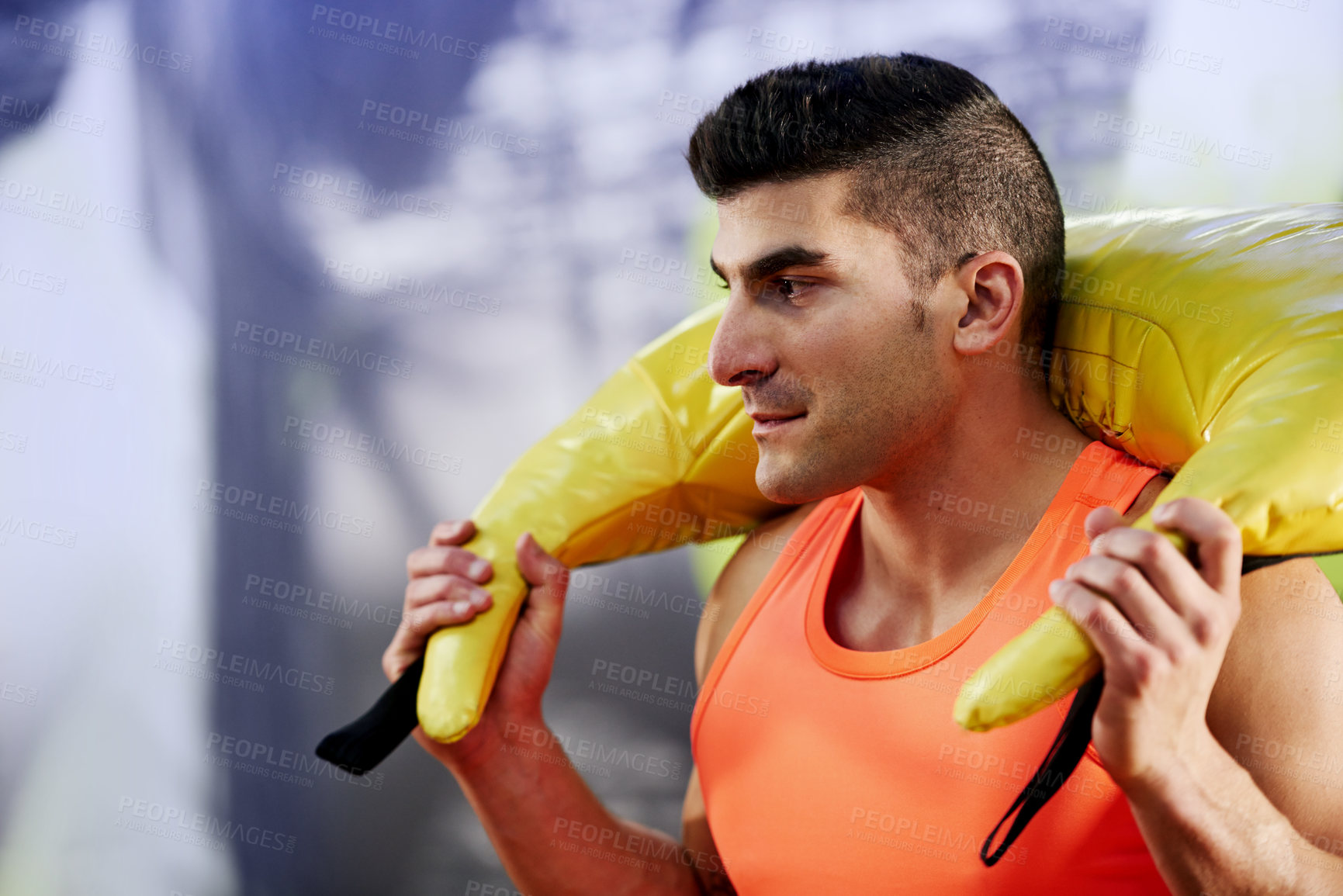 Buy stock photo Strong, carry or athlete with sand bag for training class, workout intensity or core strength in club. Man, lift or male person in gym with weight equipment for fitness cardio, body health or power
