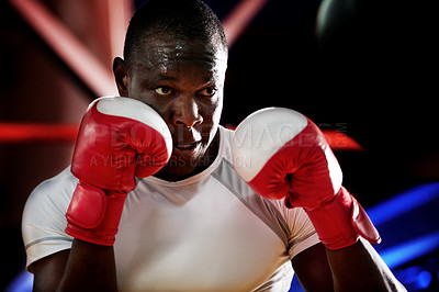 Buy stock photo Sweating, serious or black man in ring for boxing exercise, match or self defense in gym. Strong, athlete or African boxer in practice for training, competition or fitness workout with fighting skill