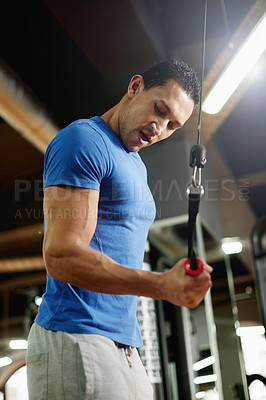 Buy stock photo Training, bicep and machine with man in gym for cable pulley, fitness and muscle development. Workout equipment, athlete and strong with intense person in sports club for bodybuilder exercise