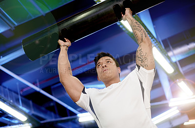 Buy stock photo Fitness, workout and tube with man in gym for metal equipment, bodybuilder and challenge. Health, athlete and wellness with low angle of person in sports club for weightlifting, exercise and muscle