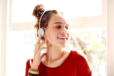 Buy stock photo Music, smile and thinking with teen girl at window in home for radio streaming or weekend relax. Headphones, idea and wellness with happy student person in campus apartment for college or university