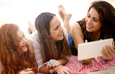 Buy stock photo Tablet, friends and women at beach for holiday, travel and vacation for bonding together. Girls, social media and people relax with smile, technology and ocean trip in Miami for summer adventure