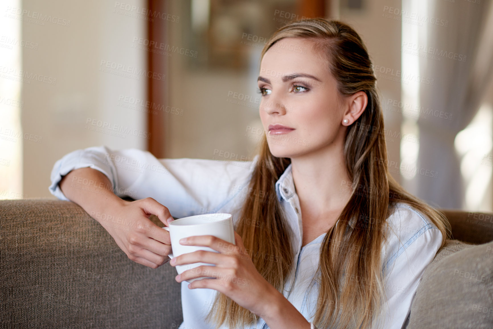 Buy stock photo Thinking, coffee and portrait of woman on sofa for calm, peaceful and break in morning at home. Memory, cappuccino and female person drinking warm beverage with nostalgia in living room at apartment.