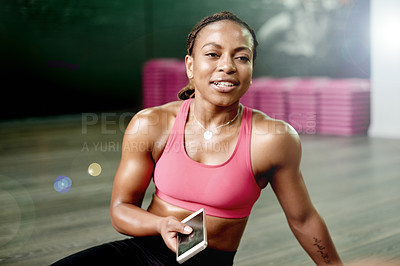 Buy stock photo Portrait, athlete and black woman with phone at gym for fitness app, rest and exercise break. Happy, person and relax with mobile from training, review progress and notification for sports membership