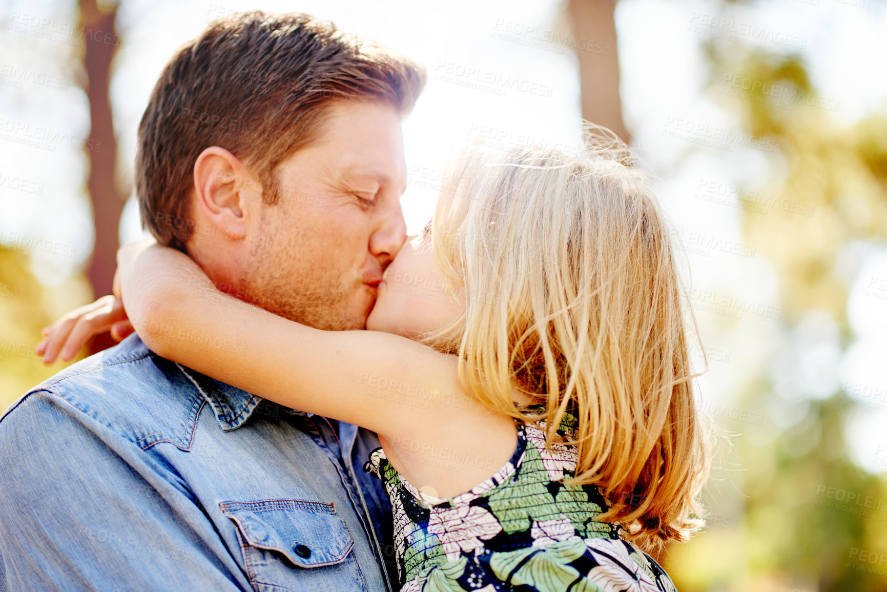 Buy stock photo Father, love and kiss child in park for care, safety and bonding together for connection on holiday. Papa, carry girl and embrace kid in nature for support, trust and parent on family vacation