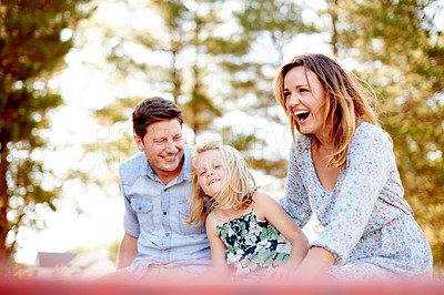 Buy stock photo Happy, parents and child carousel at playground for holiday fun, playing games and bonding together. Smile, family or kid on merry go round for spinning ride, activity and balance support on vacation