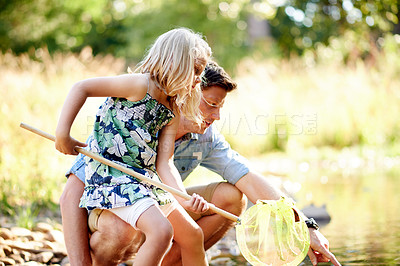 Buy stock photo Father, child and fishing with net in river for holiday adventure, teaching skills and bonding. Family activity, single dad and girl catch fish in water for summer vacation, learning and development