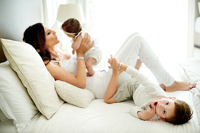 Buy stock photo Baby, mother and portrait of boy in bedroom of home together for bonding, family time or security. Growth, maternity or relationship with woman, son and daughter on bed in apartment for wellness