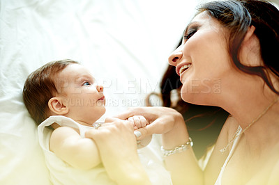 Buy stock photo Love, mom and baby in house on bed, relax and bonding together in nursery. Mother's Day, care and happy family in bedroom with newborn, relationship growth and connection for childhood development.