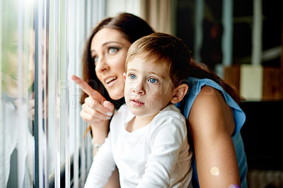 Buy stock photo Window, mom and kid with view, game and learning in house with fun conversation. Happiness, woman and playing with son in home for bonding, daydreaming and child development with support together