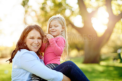 Buy stock photo Mom, girl and smile in portrait at park with bonding, care and excited on ground in nature. Happy family, mother and daughter in garden, summer and outdoor with hug for relationship in Portugal
