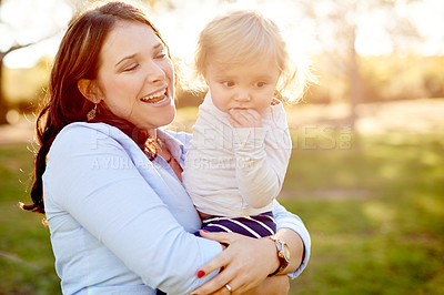 Buy stock photo Outdoor, smile and mother with child for carrying, relationship and connection together in park. Happy family, mom and girl with love for bonding, caring and sunshine on weekend holiday in nature