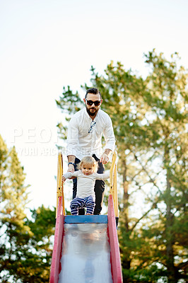 Buy stock photo Father, girl and park with slide, baby and play outdoor in summer with care, love and support. Dad, kids and helping hand with space in nature, guide or bonding with family for games in New Zealand
