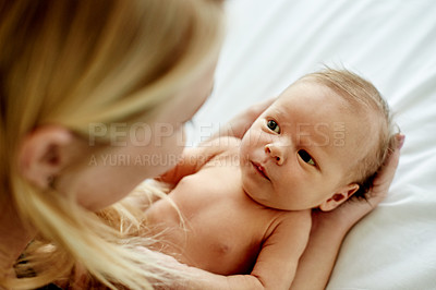 Buy stock photo Relax, love and mom with baby on bed for bonding, care and family time in home together. Happy, security and newborn child with mother in bedroom for support, safety and protection in apartment.