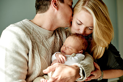 Buy stock photo Home, kiss and couple with baby, family and bonding together with infant, childcare and happiness. Kid, support and mother with father, parents and newborn with wellness, relationship and nurture