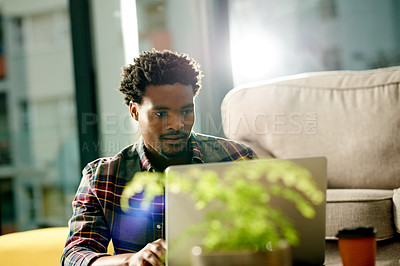 Buy stock photo Laptop, research and black man in house for remote work, freelance and creative project in living room. Email, computer and African male copywriter with online article for publishing in apartment.