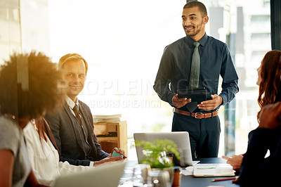 Buy stock photo Speaker, meeting and tablet with business man in office for stakeholder, project proposal and planning. Teamwork, research and collaboration with employees in agency for profit report and review