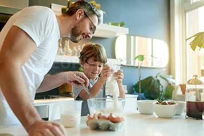 Buy stock photo Happy, baking and family in house with utensils, bonding and support in learning to cook. Smile, mature father and son in kitchen with ingredients, help or communication for childhood development.