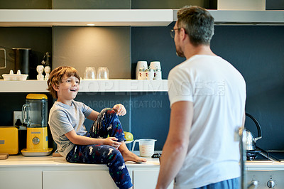 Buy stock photo Happy, counter and father with child in kitchen with conversation, bonding and morning routine. Smile, connection and dad with boy kid for talking and cooking breakfast together on weekend in house.