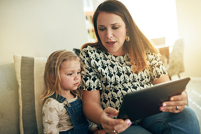 Buy stock photo Pregnant, woman and child on couch with tablet, watching or teaching for educational video. Support, mother or daughter in home with tech, mobile app and connection for childhood development.